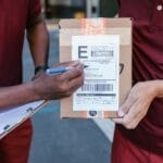 Delivery People Holding a Package